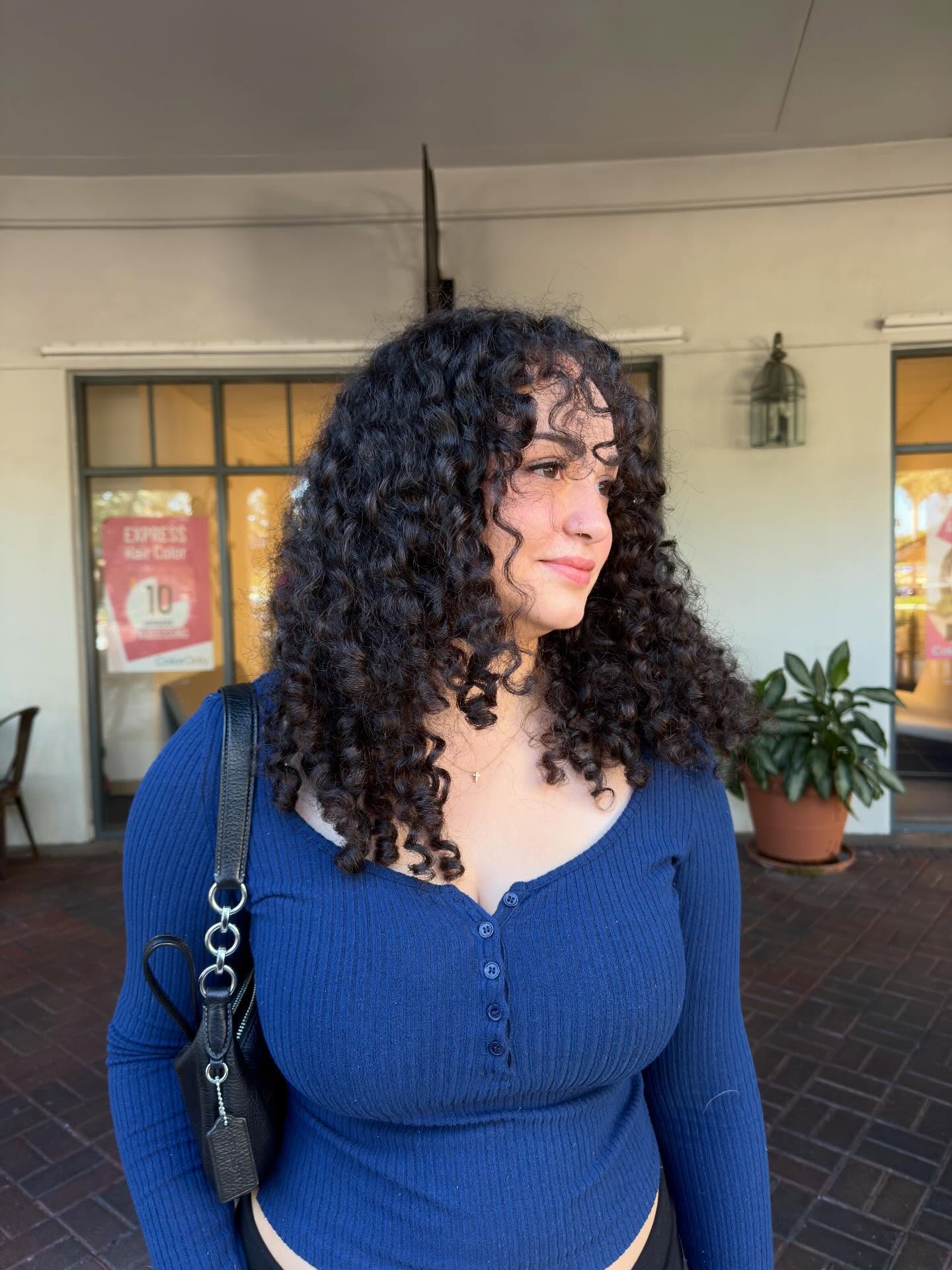 Defined, voluminous curls shaped with a curly cut