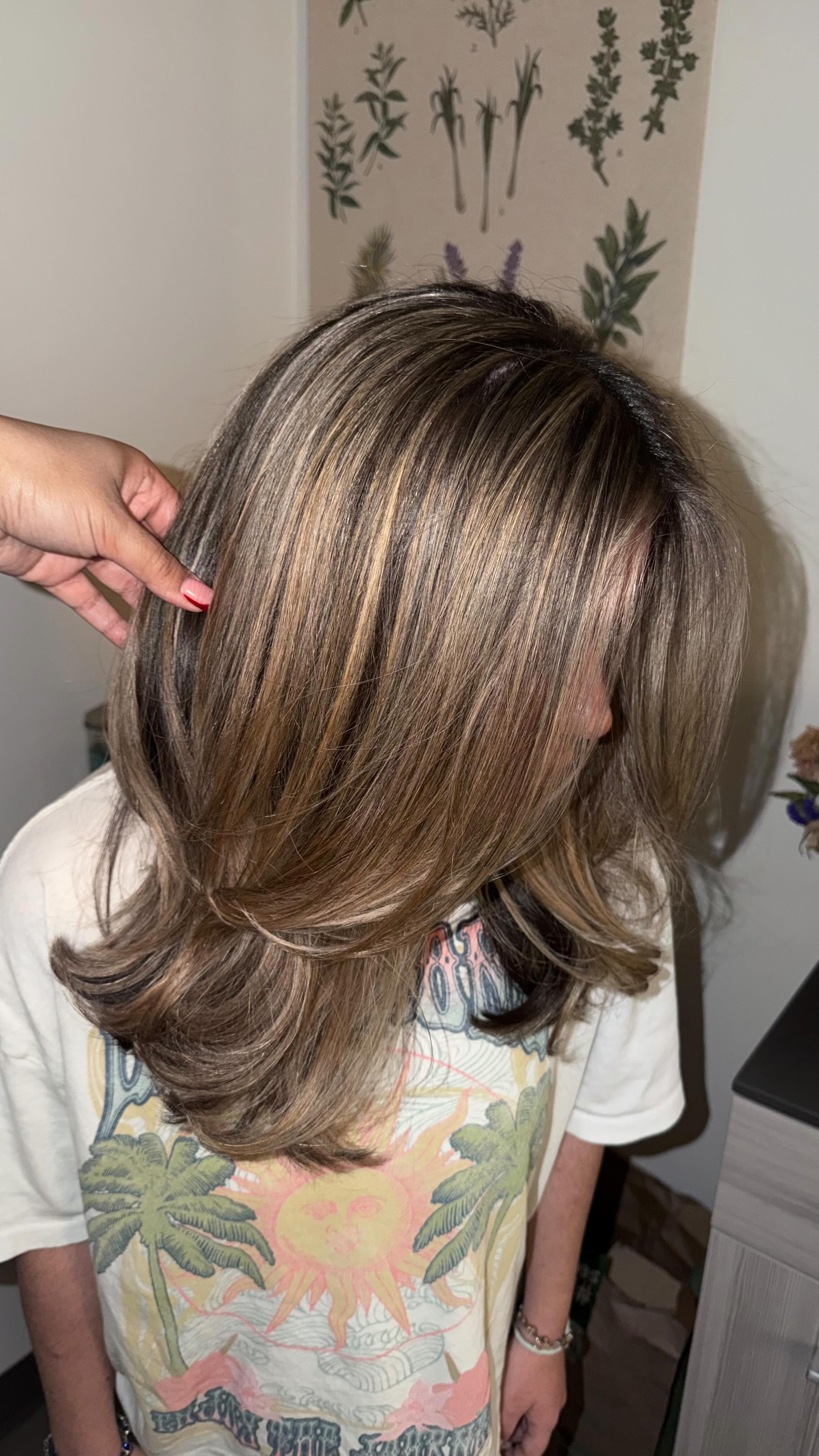Partial highlights giving soft, lived-in dimension to brunette layers