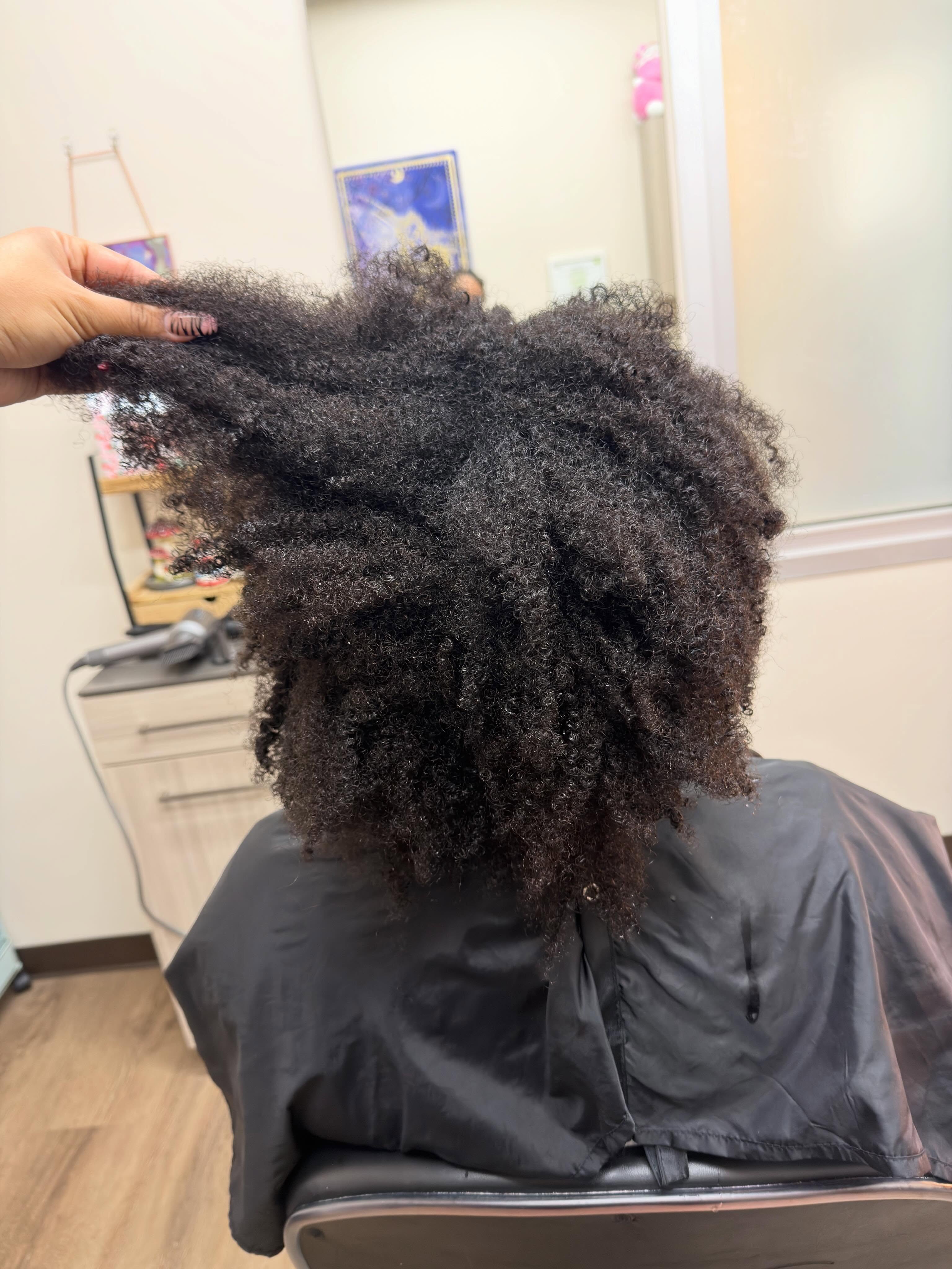 Before: natural coils ahead of a silk press