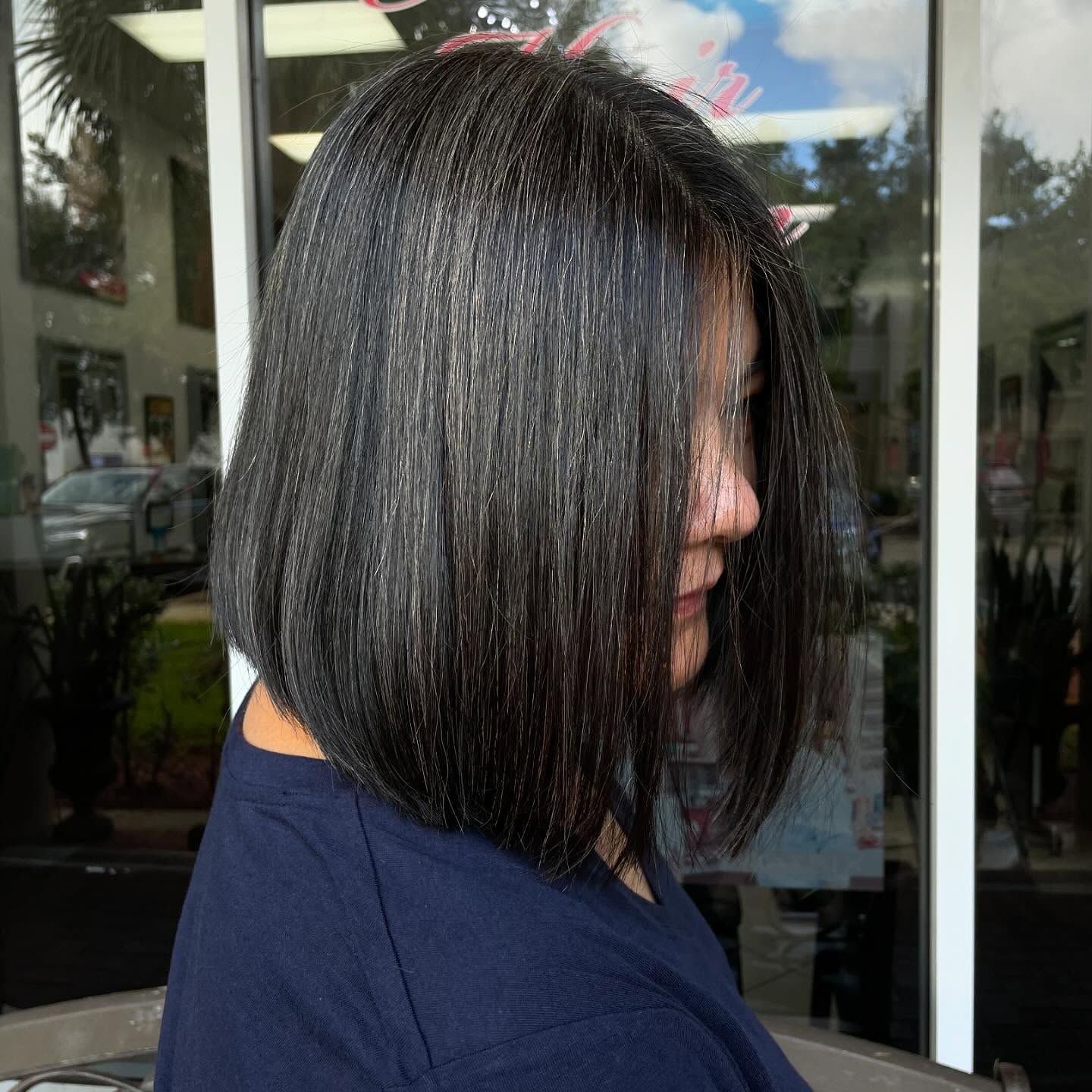 Sleek, glass-smooth dark bob with a clean line