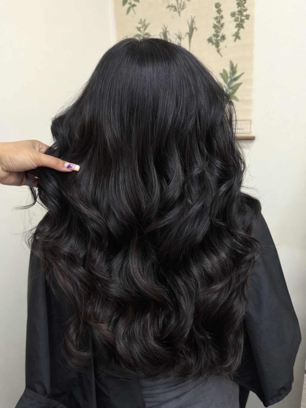 Glossy, frizz-free black waves after a Hair Botox treatment