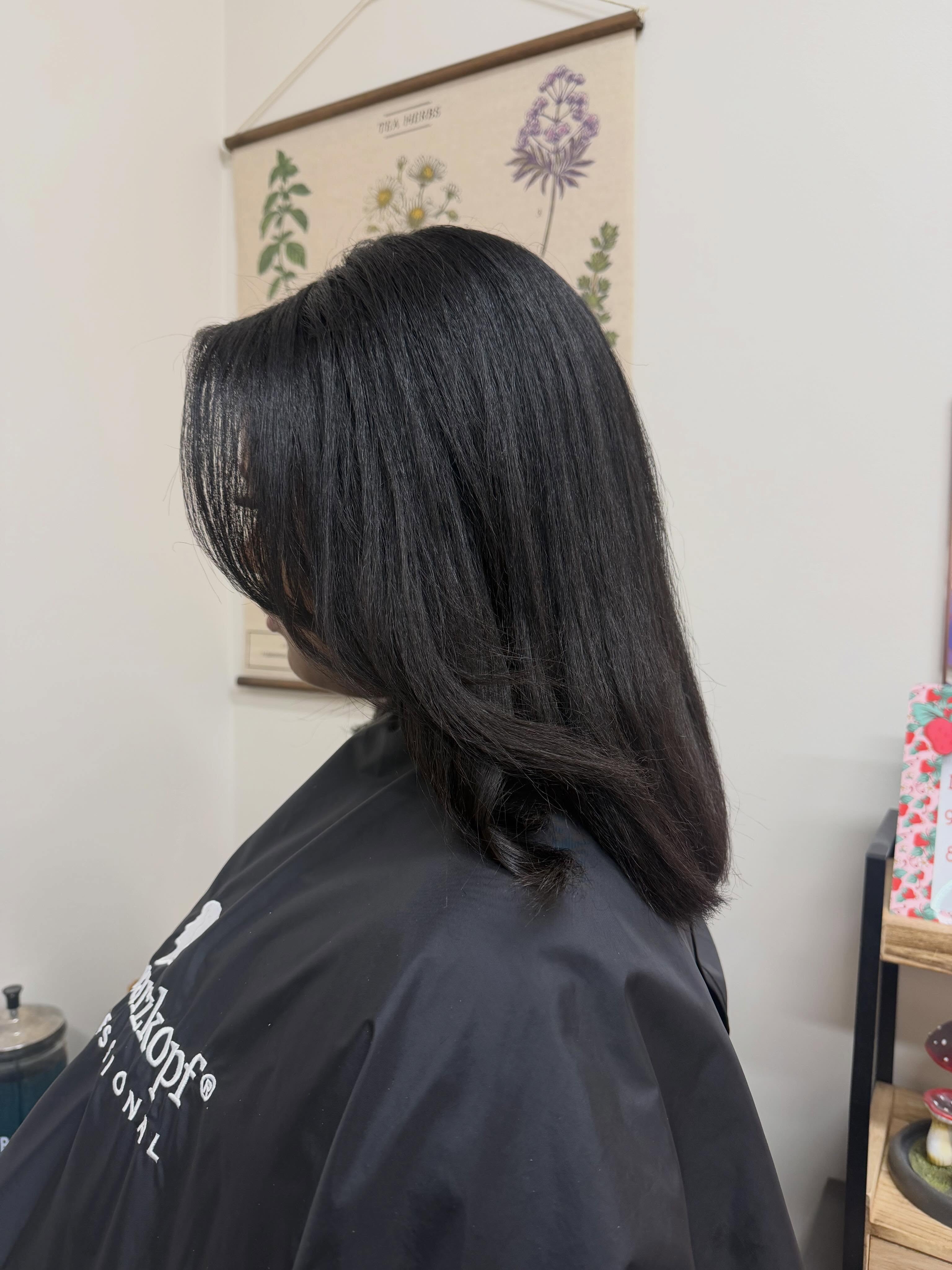 Sleek, swinging silk press on natural hair